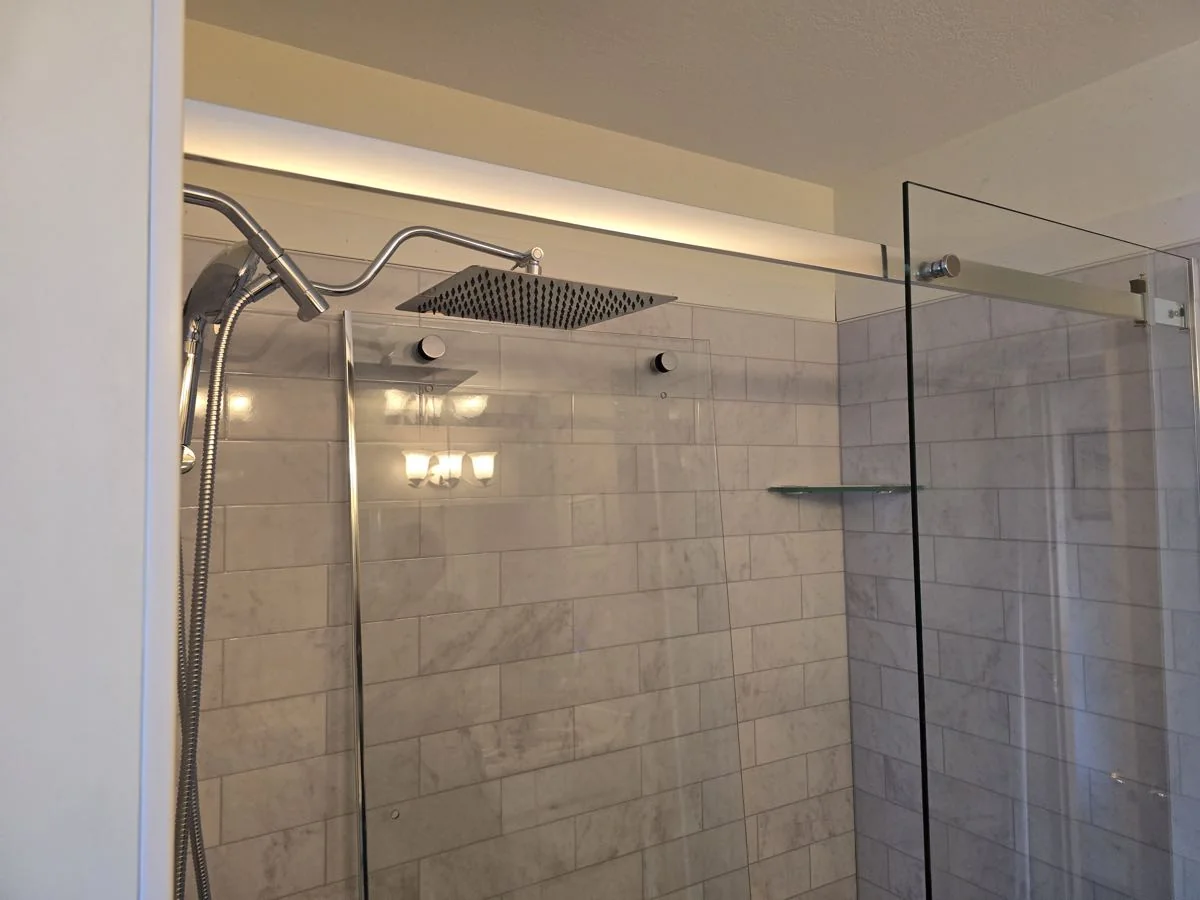 Walk-in tile shower with rainfall shower head