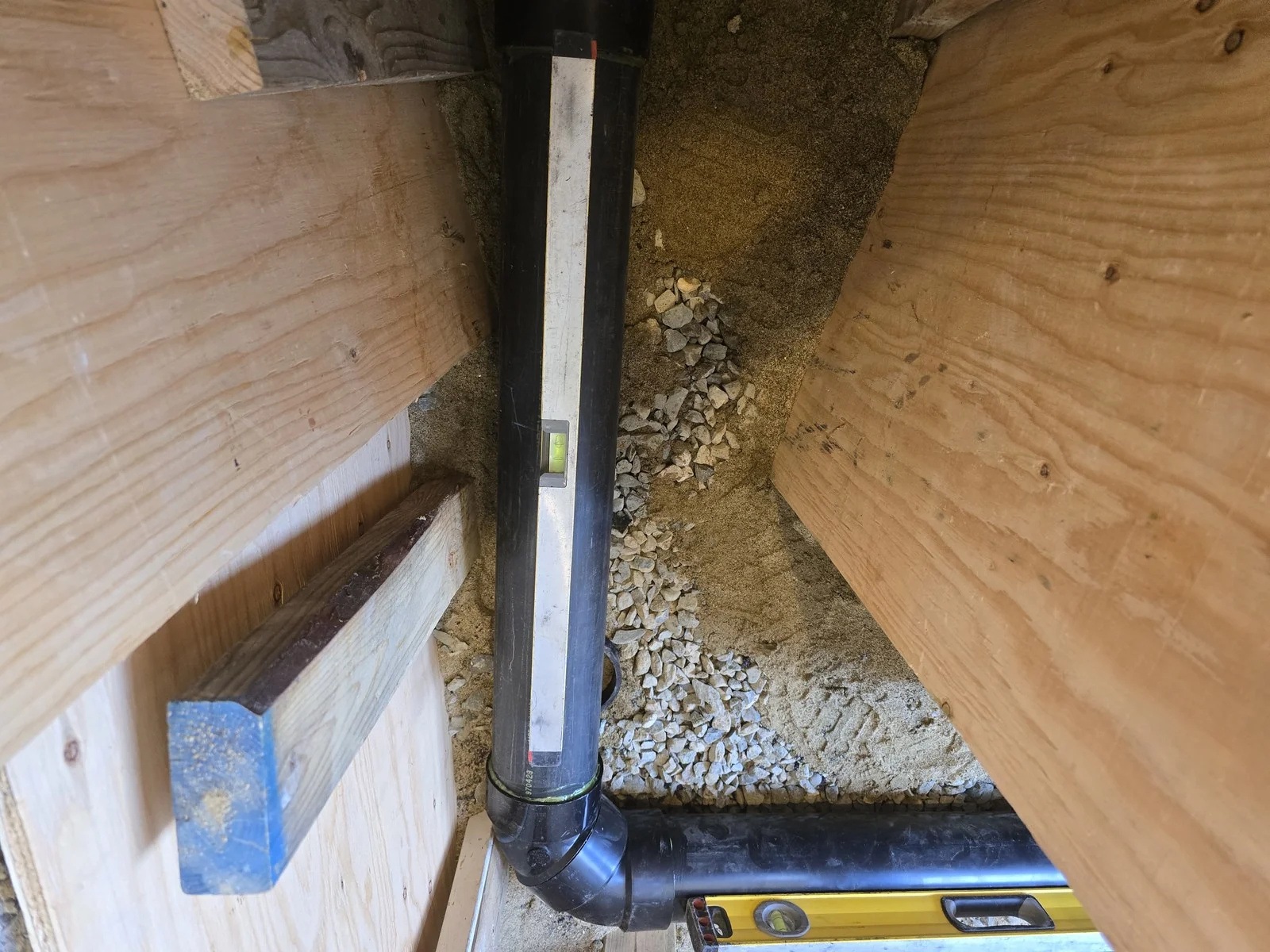 Levelled ABS stack and drain assembly in a shored excavation